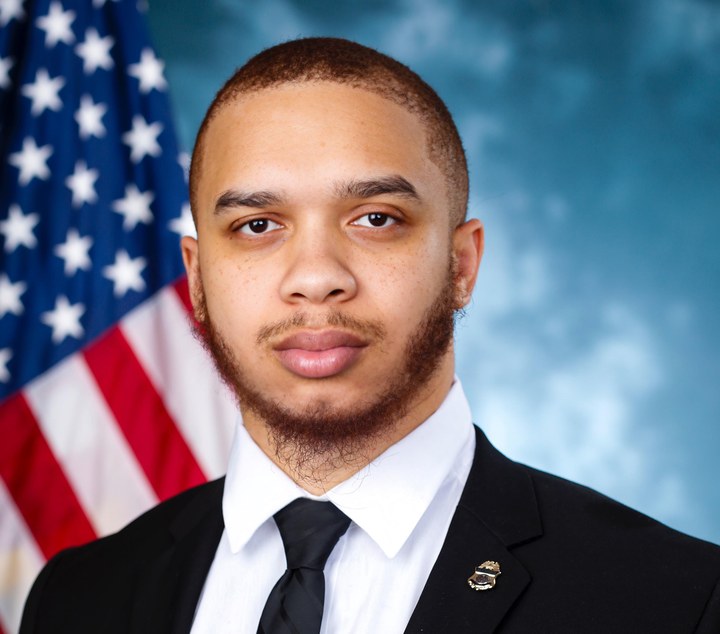 First Lieutenant Jeffery Allen, Jr. in front of the American flag